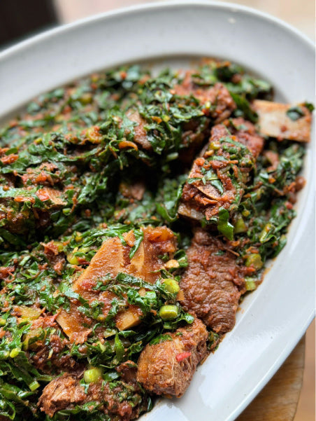 Mixed cuts with greens dish on a white oval plate